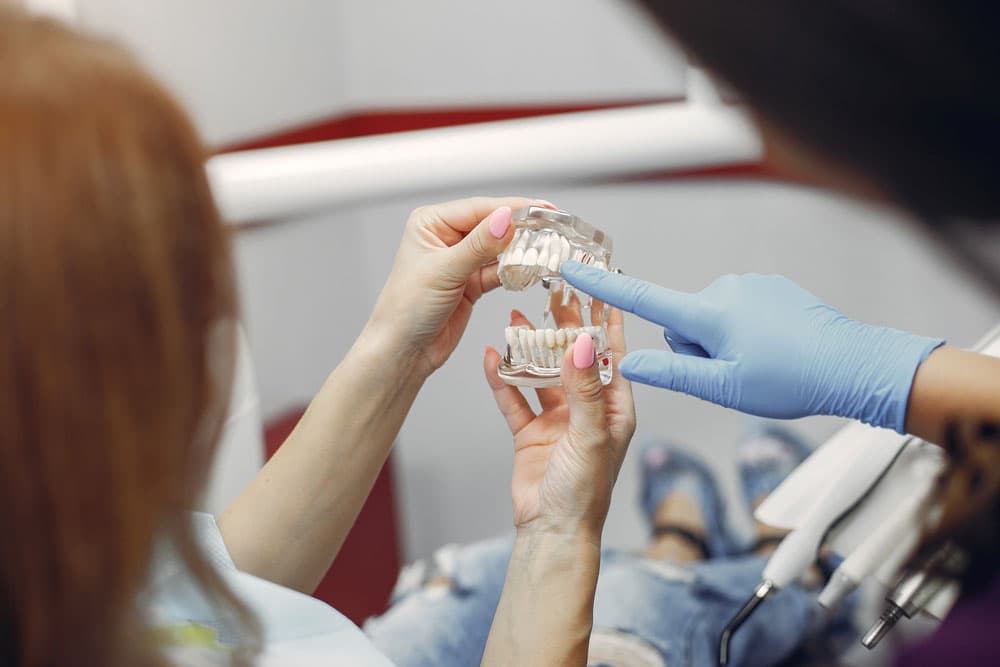 Porcelain dental implants help restore bright white teeth