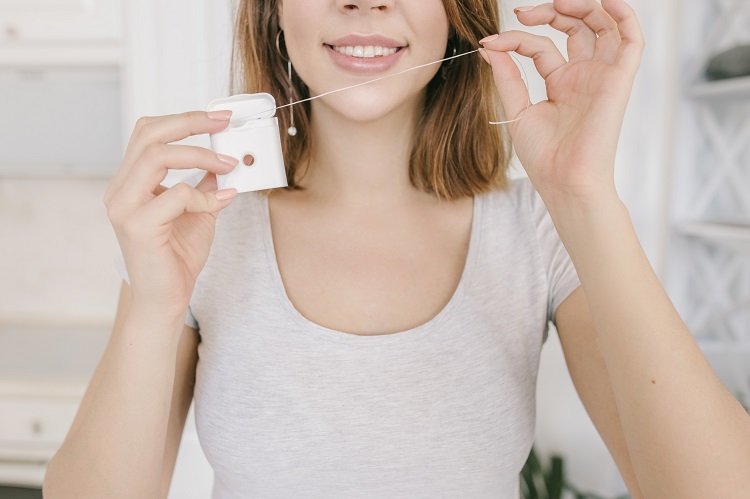 floss regularly for healthy teeth